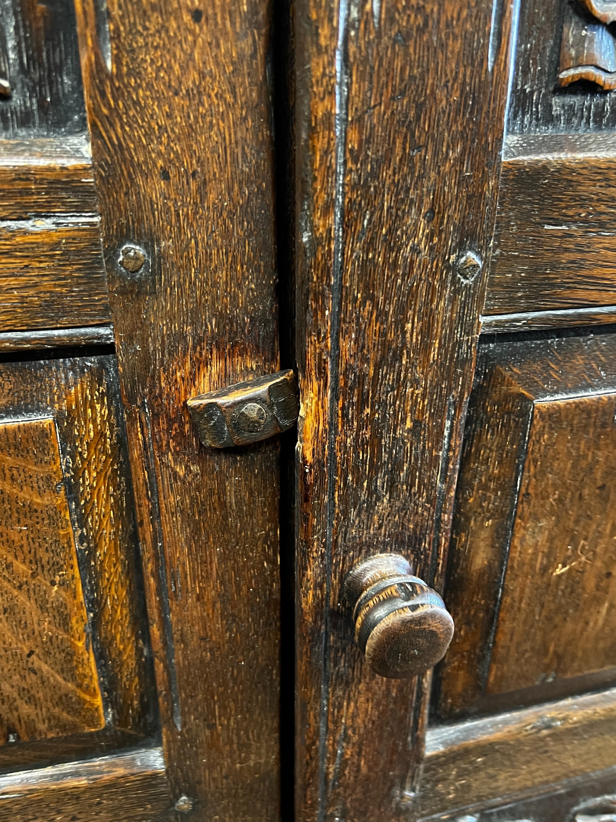 An 18th century style oak linenfold moulded wardrobe, width 123cm, depth 53cm, height 185cm